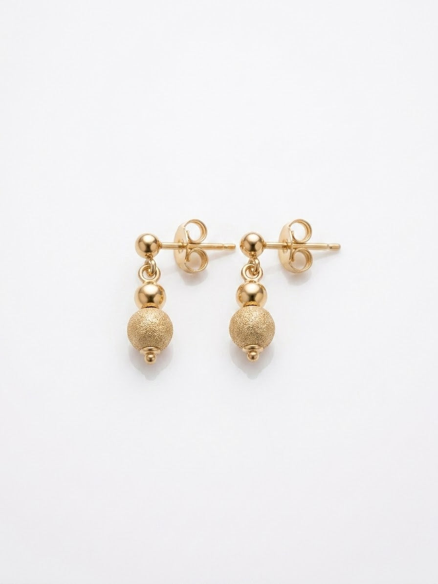 18K Italian yellow gold graduated bead drop earrings by Almas Jewellery Vienna, featuring elegant dangling bead design.
